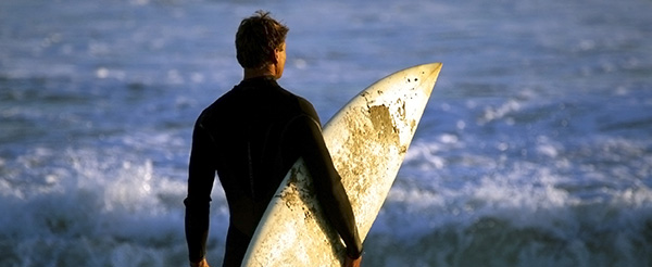 Man holding surf board